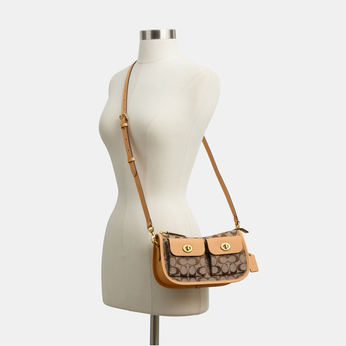 Coach |  Bolso Waverly con doble cierre giratorio en jacquard exclusivo.
