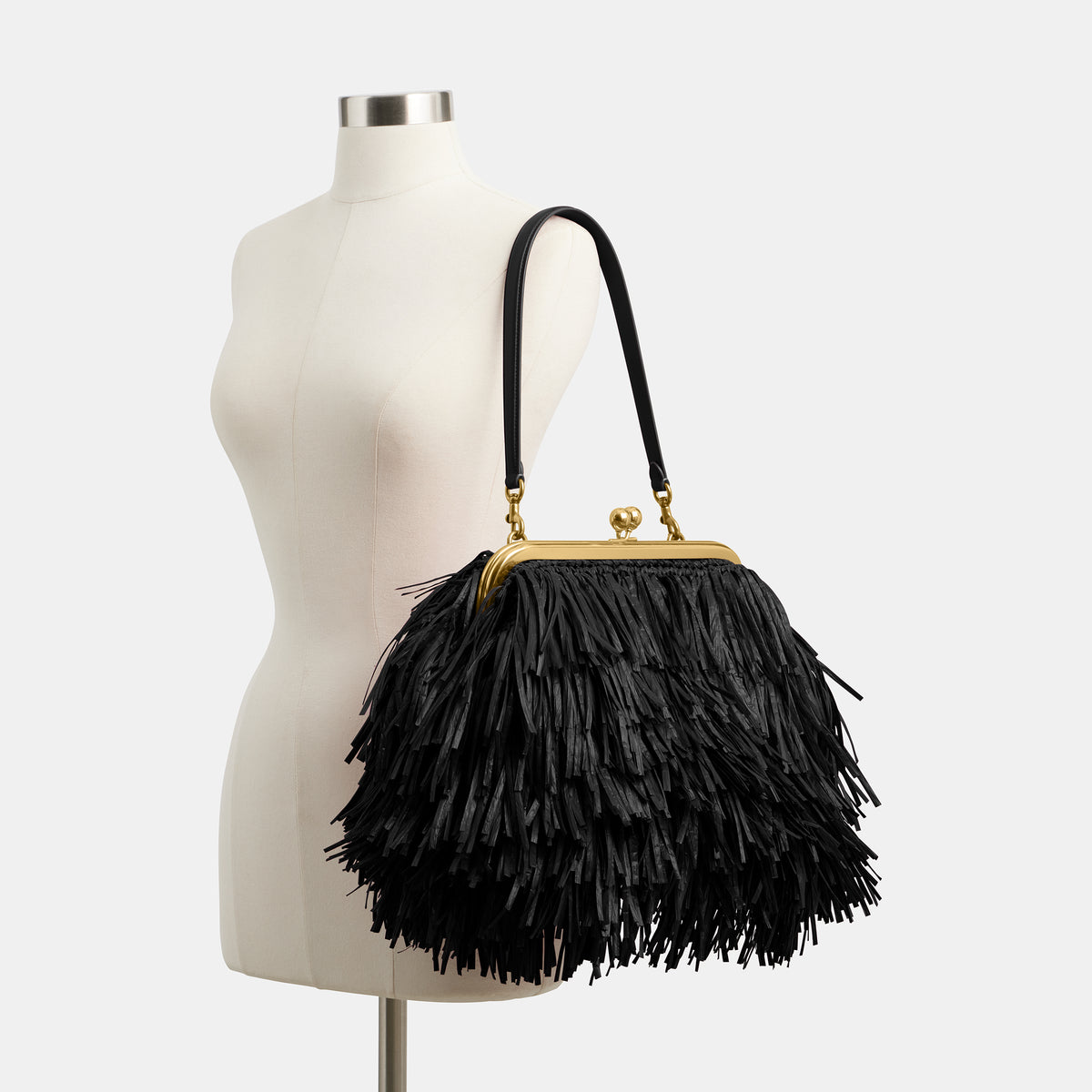 Coach  |  Bolsa para cuadro Kisslock 27